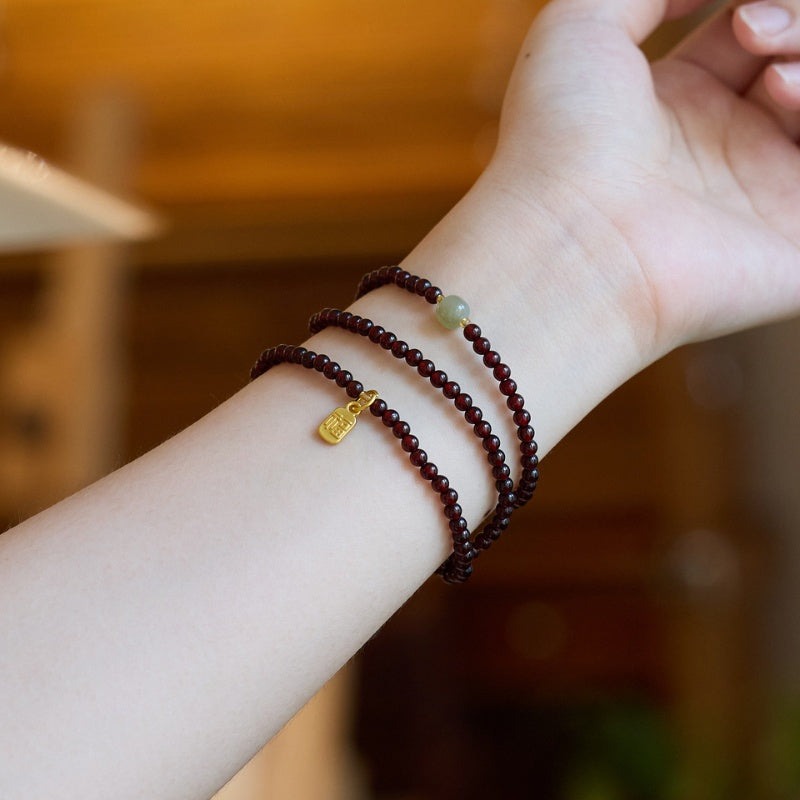 exclusive: red garnet beads fu wealth bracelet
